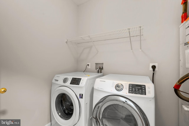 clothes washing area with laundry area and washing machine and dryer