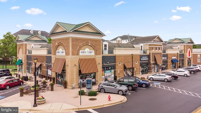 view of property featuring uncovered parking