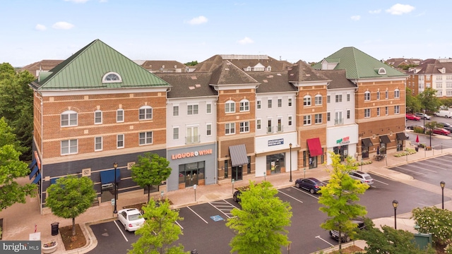 view of building exterior with uncovered parking