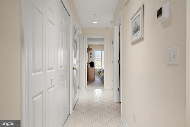 hallway with light tile patterned floors