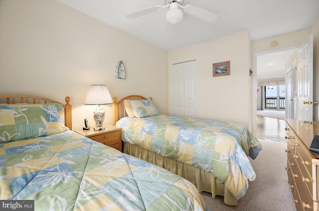 bedroom with carpet floors, a closet, and ceiling fan