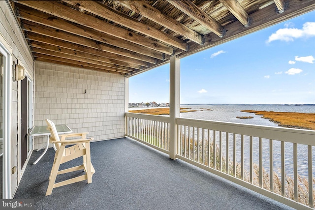 balcony featuring a water view