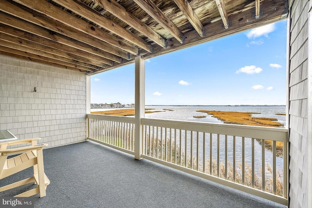 balcony featuring a water view