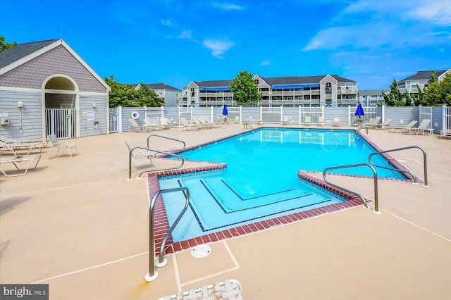 view of swimming pool with a patio area