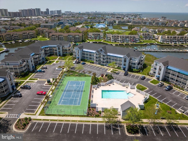 birds eye view of property with a water view