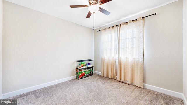 rec room featuring light colored carpet and ceiling fan