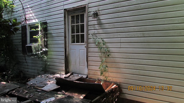 view of exterior entry featuring cooling unit