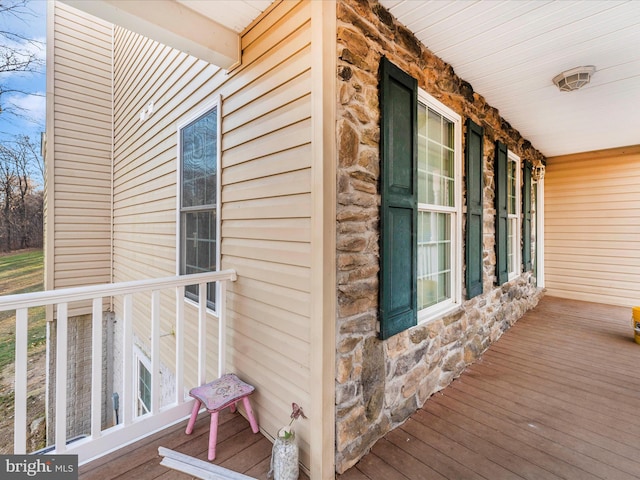 wooden terrace featuring a porch