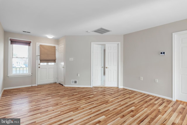 spare room with light wood-type flooring