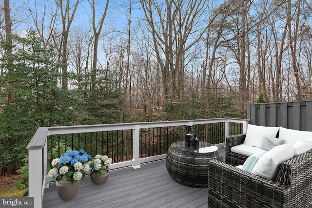 wooden terrace with an outdoor hangout area