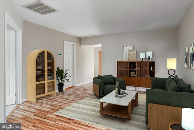 living room with light hardwood / wood-style flooring