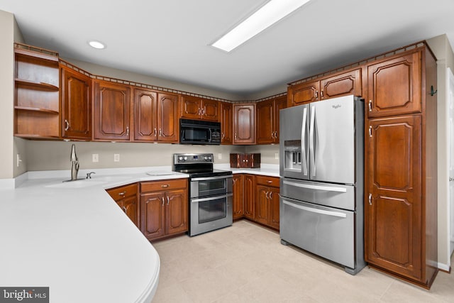 kitchen with sink and appliances with stainless steel finishes