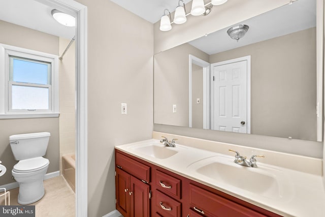 full bathroom with tile patterned floors, vanity, tub / shower combination, and toilet