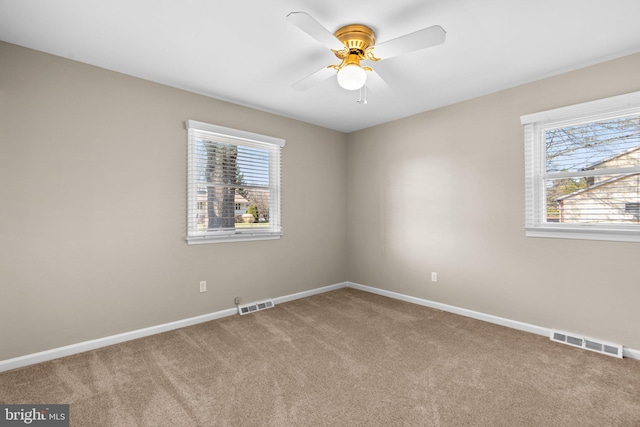 unfurnished room featuring carpet flooring and ceiling fan