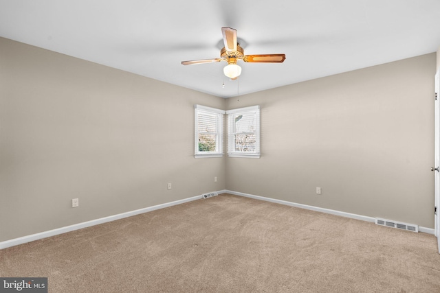 carpeted empty room with ceiling fan