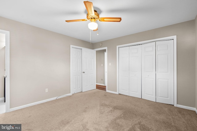 unfurnished bedroom featuring carpet floors and ceiling fan