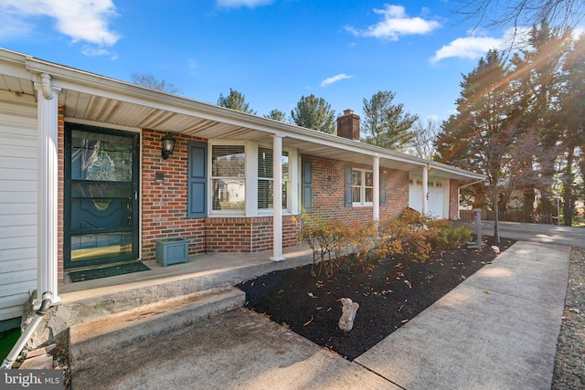 view of front of house with a porch and a garage