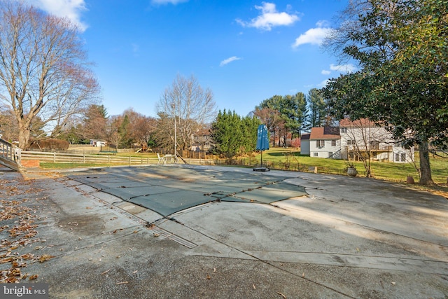 view of swimming pool with a yard and a patio