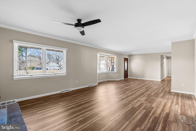 unfurnished room with wood-type flooring, plenty of natural light, and ornamental molding