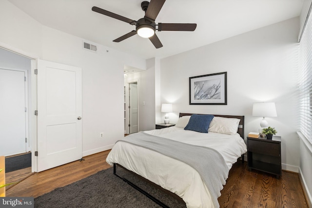 bedroom featuring ceiling fan and dark hardwood / wood-style floors