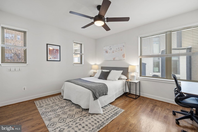 bedroom with ceiling fan and wood-type flooring