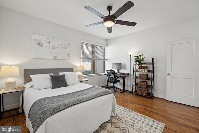 bedroom featuring ceiling fan and dark hardwood / wood-style flooring