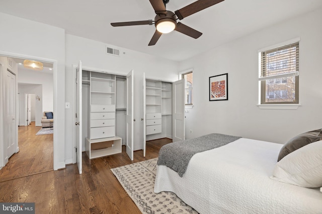 bedroom featuring ceiling fan and dark wood-type flooring