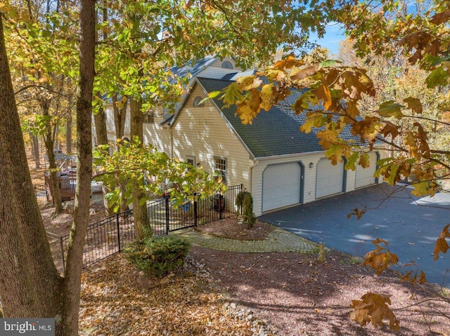 view of side of home featuring a garage