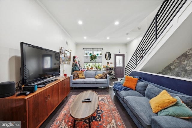 living room featuring dark hardwood / wood-style floors and ornamental molding