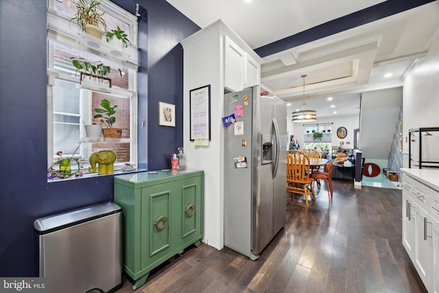 kitchen with dark hardwood / wood-style flooring, stainless steel fridge, decorative light fixtures, white cabinets, and green cabinetry