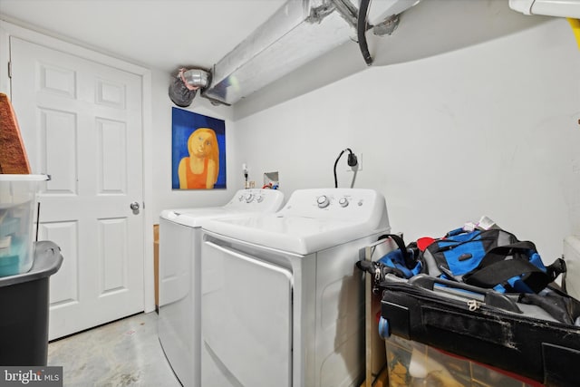 washroom with washing machine and clothes dryer