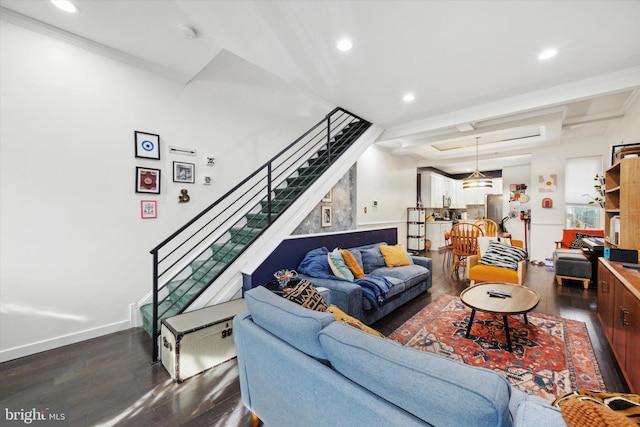 living room with dark hardwood / wood-style flooring and ornamental molding