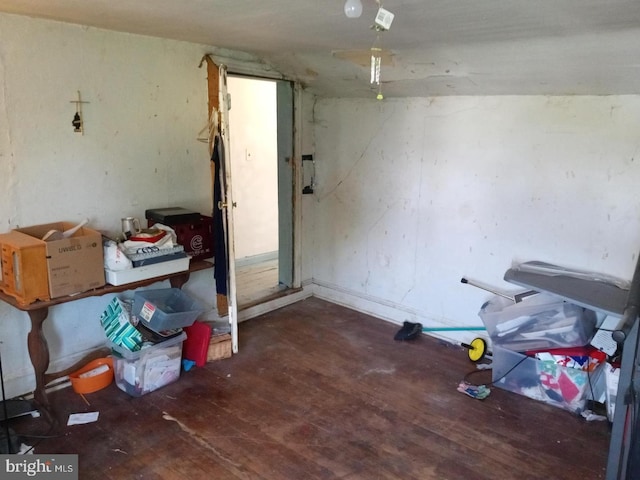 misc room with hardwood / wood-style floors and vaulted ceiling