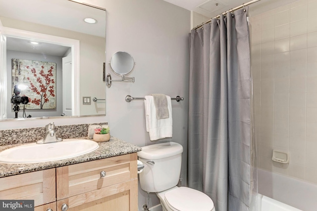 full bathroom featuring vanity, toilet, and shower / tub combo