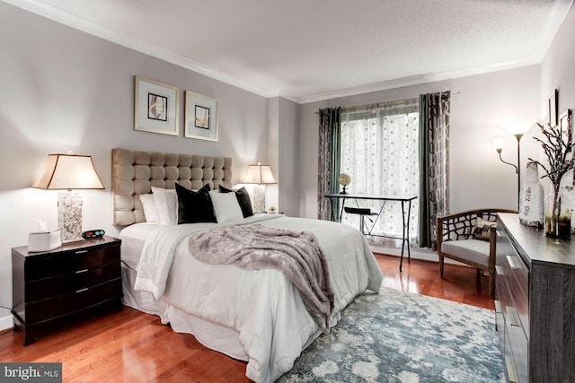 bedroom featuring light hardwood / wood-style flooring and ornamental molding