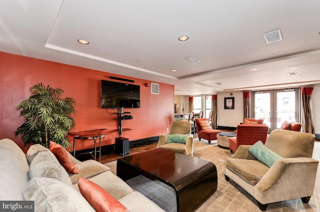 living room with a tray ceiling