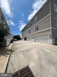 view of side of home featuring a garage