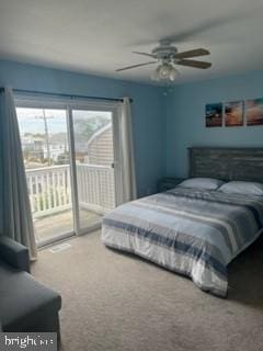 bedroom with carpet, ceiling fan, access to exterior, and multiple windows