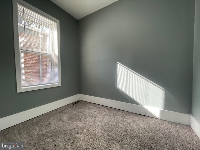 unfurnished room featuring carpet floors