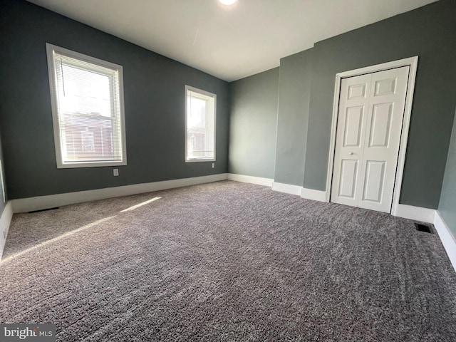 unfurnished room featuring carpet floors