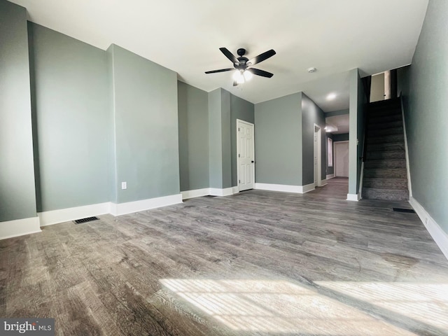 unfurnished living room with ceiling fan and hardwood / wood-style flooring