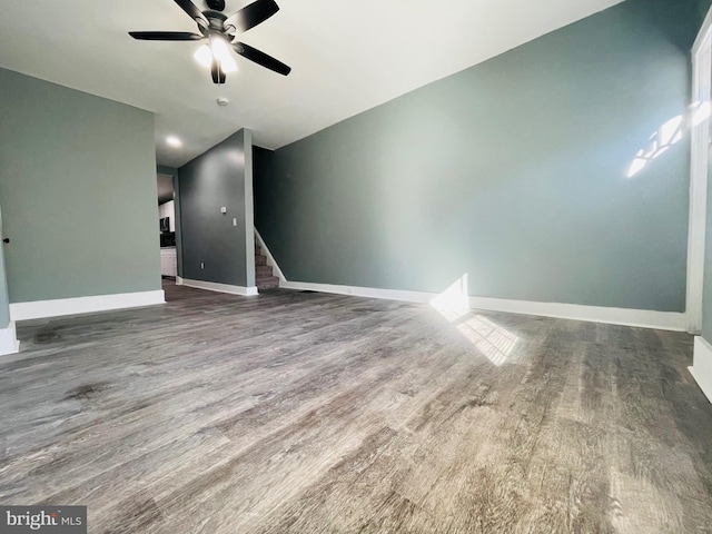 unfurnished living room featuring hardwood / wood-style floors and ceiling fan