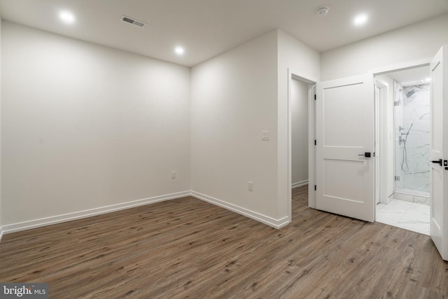 empty room with dark wood-type flooring