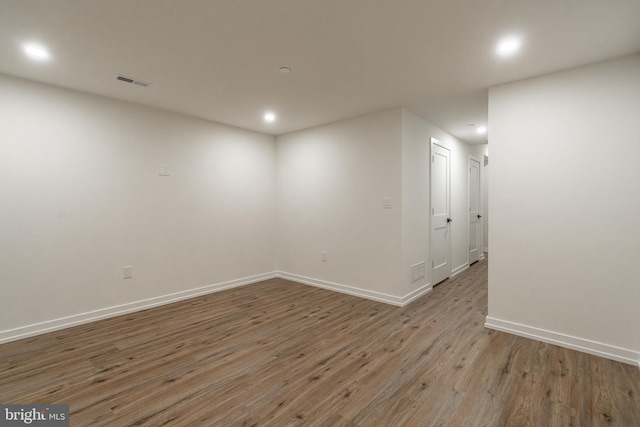 empty room featuring wood-type flooring