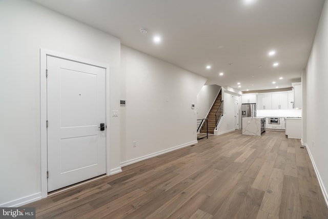 unfurnished living room featuring light wood-type flooring