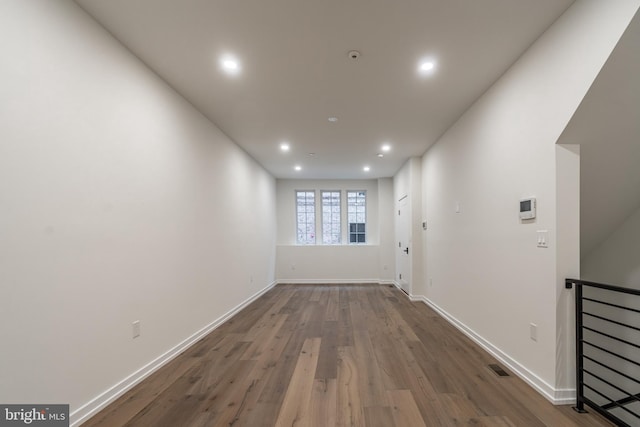 hallway featuring dark hardwood / wood-style floors