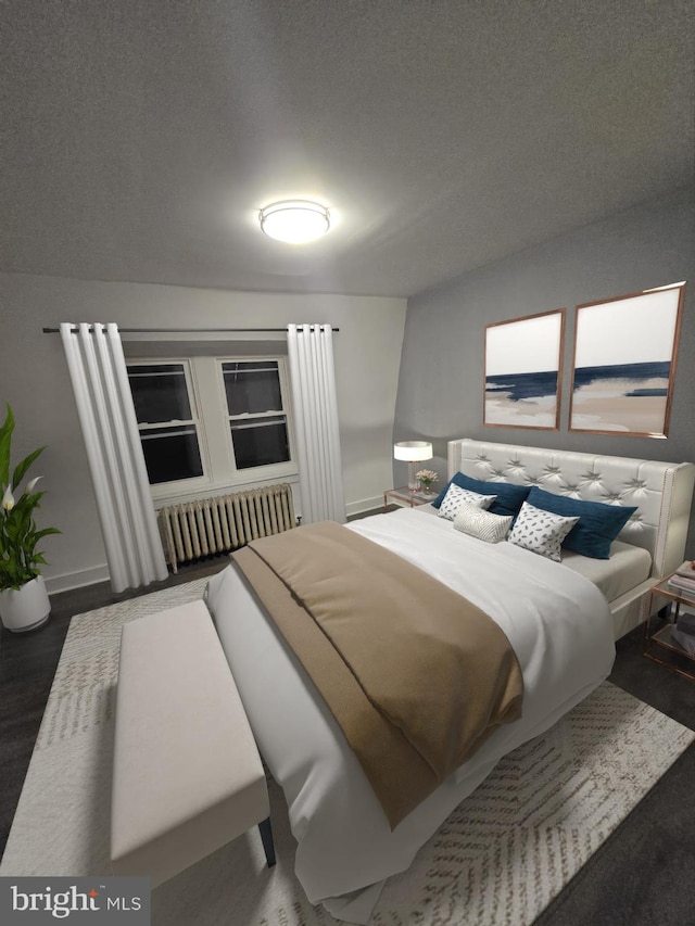 bedroom with dark wood-type flooring and a textured ceiling