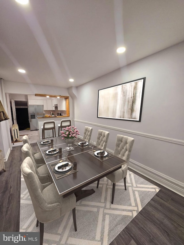 dining area with dark wood-type flooring