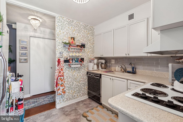 kitchen with white gas cooktop, sink, white cabinetry, and black dishwasher