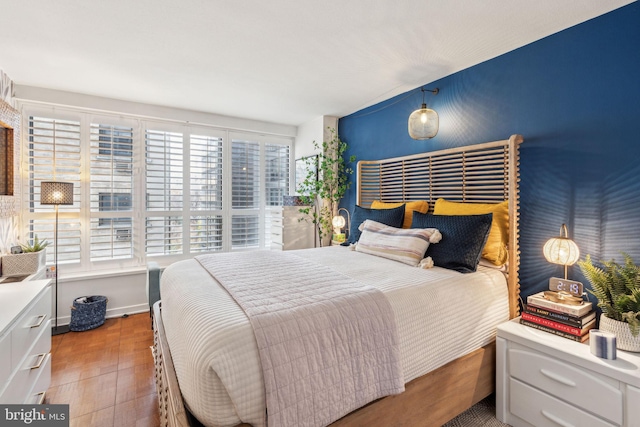 bedroom featuring wood-type flooring